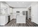 Modern kitchen with stainless steel appliances, white cabinets, and a large island at 6723 Collisi Pl, Brownsburg, IN 46112