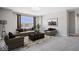 Living room showcasing large windows, neutral walls, and carpet flooring at 6723 Collisi Pl, Brownsburg, IN 46112