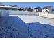 A spacious fenced backyard covered in snow on a sunny day in winter at 686 N Sobota Way, Trafalgar, IN 46181