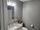 Cozy bathroom with granite vanity, sink, toilet and decorative accents at 686 N Sobota Way, Trafalgar, IN 46181