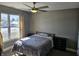 Well-lit bedroom featuring a ceiling fan, and large window allowing for ample natural light at 686 N Sobota Way, Trafalgar, IN 46181