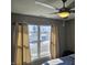 This bedroom features a ceiling fan and a large window allowing for ample natural light at 686 N Sobota Way, Trafalgar, IN 46181