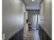 Hallway leading to the kitchen and dining room with decorative accents at 686 N Sobota Way, Trafalgar, IN 46181