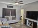 Comfortable living room with a gray sofa, modern decor, and a TV on a stand at 686 N Sobota Way, Trafalgar, IN 46181