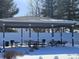 Community pavilion with picnic tables in a snowy outdoor setting at 686 N Sobota Way, Trafalgar, IN 46181