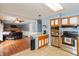 Open layout connecting the kitchen and living room, complemented by stainless steel appliances and bar seating at 6907 Buick Dr, Indianapolis, IN 46214