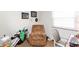 Cozy office space with a recliner, desk, and personal touches, perfect for work or relaxation at 6907 Buick Dr, Indianapolis, IN 46214