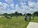 Fenced dog park with benches, providing a safe and enjoyable space for pets and their owners at 7026 Barrett Dr, Brownsburg, IN 46075