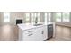 Stylish kitchen island with a stainless steel sink, built-in dishwasher and quartz countertops at 7026 Barrett Dr, Brownsburg, IN 46075