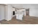 Modern kitchen featuring white cabinets, stainless steel appliances, and a center island at 7026 Barrett Dr, Brownsburg, IN 46075