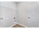 Utility room featuring washer and dryer hookups, shelving and a door at 7026 Barrett Dr, Brownsburg, IN 46075