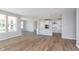 Bright, open living space seamlessly connecting the kitchen and living room with plenty of natural light at 7026 Barrett Dr, Brownsburg, IN 46075