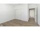 Neutral bedroom with hardwood floors, large closet, and access to the ensuite bathroom at 7038 Barrett Dr, Brownsburg, IN 46112