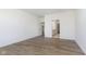 Bright bedroom with a large window, hardwood floors, and a view of the ensuite bathroom at 7038 Barrett Dr, Brownsburg, IN 46112