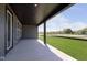 Beautiful covered patio provides ample space to enjoy the outdoors with expansive green space at 7038 Barrett Dr, Brownsburg, IN 46112