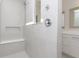 Modern walk-in shower featuring sleek tile, a built-in bench, and premium fixtures at 7038 Barrett Dr, Brownsburg, IN 46112
