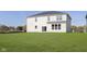 This home features a large backyard with lush green grass and a fence line at 7197 Barrett Dr, Brownsburg, IN 46112