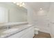 This bathroom features a double sink vanity with granite countertops and a white shower and tub at 7197 Barrett Dr, Brownsburg, IN 46112