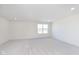 This spacious bedroom features neutral carpet, recessed lighting and a large window at 7197 Barrett Dr, Brownsburg, IN 46112