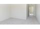 Bright bedroom features neutral carpet, white walls and open doorway to the rest of the house at 7197 Barrett Dr, Brownsburg, IN 46112