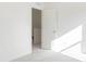 Bright bedroom features neutral carpet, white walls, and an open doorway to the next level at 7197 Barrett Dr, Brownsburg, IN 46112
