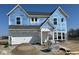 New two-story home featuring an attached two-car garage with professional building materials in a suburban neighborhood at 750 Oakleaf Dr, Greenfield, IN 46140
