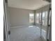 Bright office featuring neutral walls, plush carpet, and multiple windows for natural light at 750 Oakleaf Dr, Greenfield, IN 46140