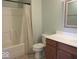 Cozy bathroom features a shower with curtain, toilet, and wood vanity with light countertop at 8148 Shores Edge Way, Indianapolis, IN 46237