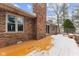A large brick house features an outdoor wooden deck and large chimney at 11131 N State Road 9, Fountaintown, IN 46130