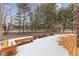 Large wooden deck in backyard with wood bench and fencing at 11131 N State Road 9, Fountaintown, IN 46130