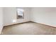 Neutral bedroom features neutral carpet, window and white walls at 11131 N State Road 9, Fountaintown, IN 46130