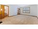 Bedroom with carpet, and view to an en suite bathroom and outdoor window views at 11131 N State Road 9, Fountaintown, IN 46130