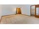 Spacious bedroom features neutral carpet and views to closet and en suite at 11131 N State Road 9, Fountaintown, IN 46130