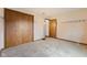 Spacious bedroom with double door closet, neutral carpet and decorative wall paper at 11131 N State Road 9, Fountaintown, IN 46130