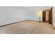 A bright bedroom features neutral carpet and a large window and light fixture at 11131 N State Road 9, Fountaintown, IN 46130