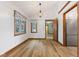 Bright dining area with wood floors, large windows, and a view of the outdoors at 11131 N State Road 9, Fountaintown, IN 46130