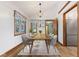 Bright dining room featuring a wood table, chandelier, and a view of the backyard at 11131 N State Road 9, Fountaintown, IN 46130