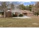 A beautiful single story brick house with a manicured lawn shows pride of ownership at 11131 N State Road 9, Fountaintown, IN 46130