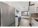 Eat-in kitchen featuring white cabinets, stainless steel appliances, and a large window at 11131 N State Road 9, Fountaintown, IN 46130
