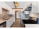 Eat-in kitchen area featuring stainless steel appliances, a gray backsplash, and ample counter space at 11131 N State Road 9, Fountaintown, IN 46130