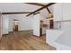 Open-concept eat-in kitchen and living space with exposed beams and plenty of natural light at 11131 N State Road 9, Fountaintown, IN 46130