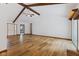 Spacious living room featuring exposed beams, hardwood floors, and neutral paint at 11131 N State Road 9, Fountaintown, IN 46130
