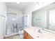 Bright bathroom with a tiled floor, shower and vanity at 120 Saratoga Way, Anderson, IN 46013