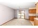 Open dining area featuring a chandelier and sliding glass doors to the backyard at 120 Saratoga Way, Anderson, IN 46013