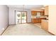 Open dining area with sliding glass doors to the backyard and access to the kitchen at 120 Saratoga Way, Anderson, IN 46013