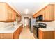 Bright kitchen featuring wood cabinets and modern appliances at 120 Saratoga Way, Anderson, IN 46013