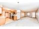 Well-lit living room with a view into the kitchen, dining area, and entry at 120 Saratoga Way, Anderson, IN 46013