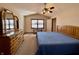 Bedroom with a large window and a wooden dresser at 1336 Country Creek Cir, Shelbyville, IN 46176