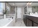 Elegant bathroom with a soaking tub, walk-in shower, and double vanity, offering a spa-like experience at 19763 Atwater Ave, Sheridan, IN 46069