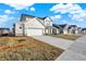 New homes line a quiet street, featuring two-car garages and a modern design at 19763 Atwater Ave, Sheridan, IN 46069